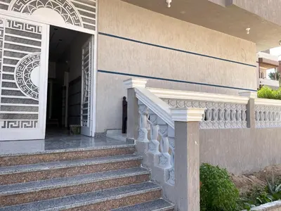 a stairway leading to a building with a door at Divers Home Safaga in Safaga