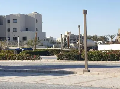a city street with buildings and a street light at Mangroovy - 2BR Prodigious Ground Pool & Sea view in Hurghada