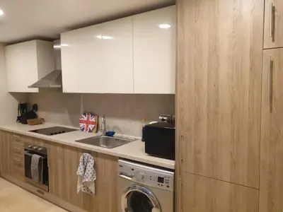 a kitchen with a sink and a washing machine at Mangroovy- 1BR Sea Breeze Back Sea view in Hurghada