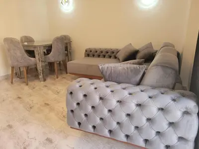 a living room with a couch and a table at Selena bay Resort with private beach - Voyage de rêve in Hurghada