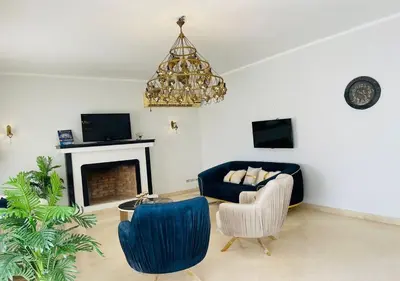 a living room with a couch and chairs and a chandelier at Unique Villa 6 B Rooms Villa 38 at El-Gouna in Hurghada