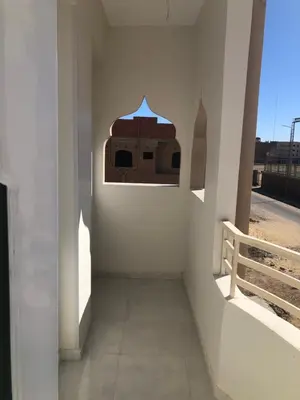 a hallway with a wall with a window at New Villa Carimo in Quseir