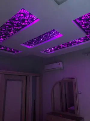a room with purple lights on the ceiling at New Villa Carimo in Quseir