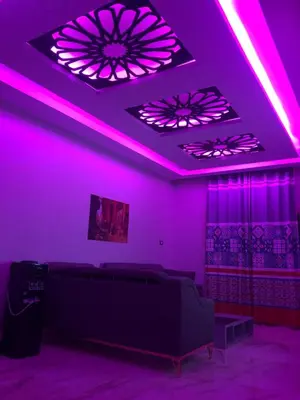 a purple room with a bed and purple lights at New Villa Carimo in Quseir