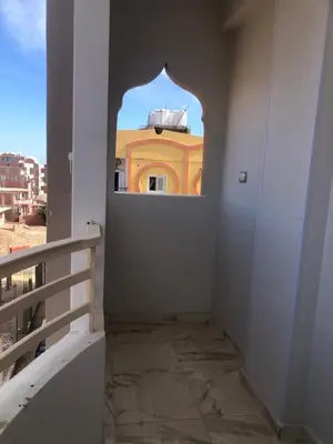 a hallway with a window in a building at New Villa Carimo in Quseir