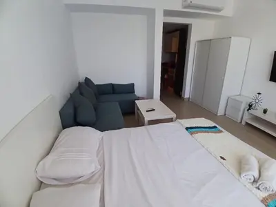 a living room with a bed and a couch at Hotel Apartment in G cribs in Hurghada