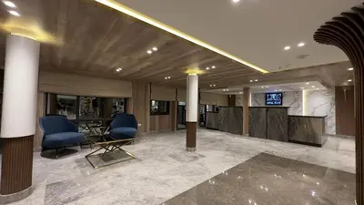 a lobby with chairs and a table in a building at book Now Nile Cruise From Aswaon every Friday & Monday & wednesday in Aswan