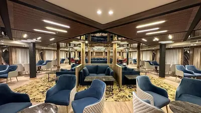 a waiting room with couches and chairs in a building at book Now Nile Cruise From Aswaon every Friday & Monday & wednesday in Aswan