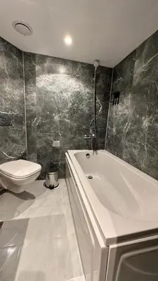 a bathroom with a white tub and a toilet at book Now Nile Cruise From Aswaon every Friday & Monday & wednesday in Aswan