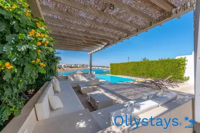 a view from the patio of a villa with a swimming pool at Ollystays Joubal Lagoon 4 BR Villa Heated Pool in Hurghada