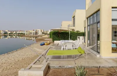 a patio with a table and chairs next to a building at Vesta - El Gouna Residence in Hurghada