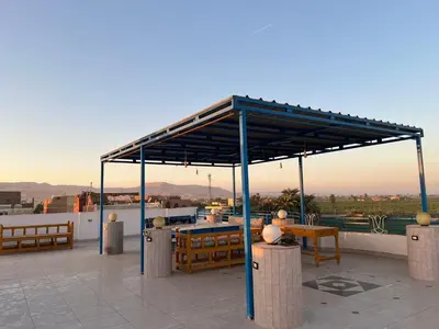 a pavilion on top of a roof with a view at Gîte Hôtel Ramla Louxor 2 in Luxor
