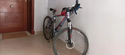 a bike hanging on a wall next to a door at Relaxing open Seaview Apartment in Hurghada