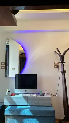 a desk with a computer on top of it at Unique studio in Aswan