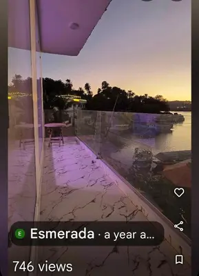 a balcony with a view of the water at Esmerada in Aswan
