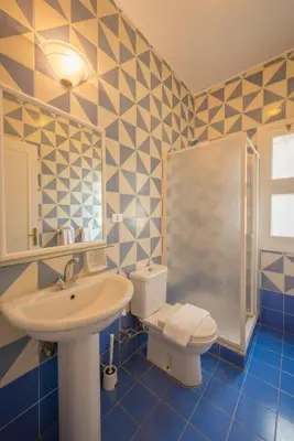 a bathroom with a sink and a toilet at Abutig Marina flat ground floor in Hurghada