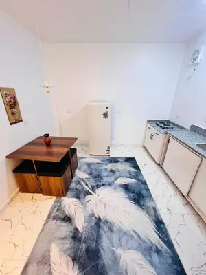 a kitchen with a floor that has feathers on it at Muhammad Ali House in Luxor