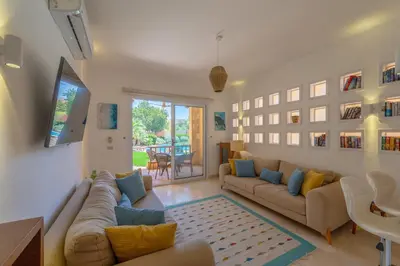 a living room with a couch and a table at Charming Apartment with Pool in prime location in Hurghada