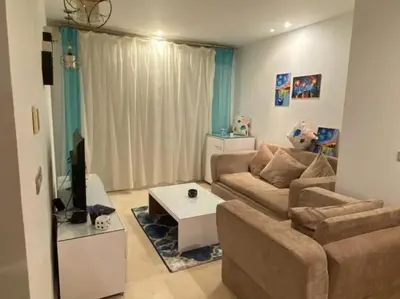 a living room with a couch and a table at one bedroom scarab club el gouna in Hurghada