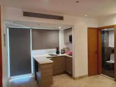 a kitchen with a sink and a toilet in it at one bedroom scarab club el gouna in Hurghada