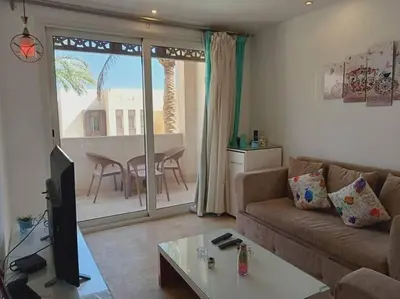 a living room with a couch and a table at one bedroom scarab club el gouna in Hurghada