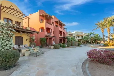 a courtyard in front of a building at Special style apartment with pool at lagoon in Hurghada