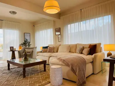 a living room with a couch and a table at 4BR Villa with Private Pool in Gouna in Hurghada