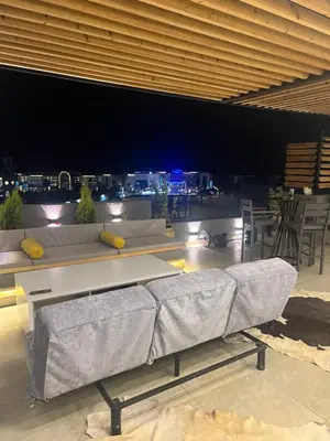 a living room with a couch and a view of the city at Sallam Lux Property in Hurghada