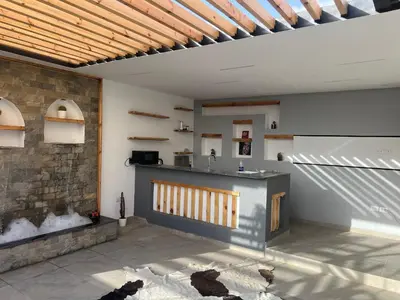 a kitchen with a counter and a brick wall at Sallam Lux Property in Hurghada