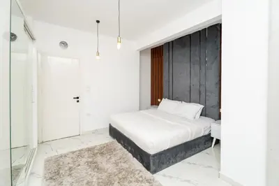 a bedroom with a bed and a mirror at Hurghada apartment luxury 001 in Hurghada
