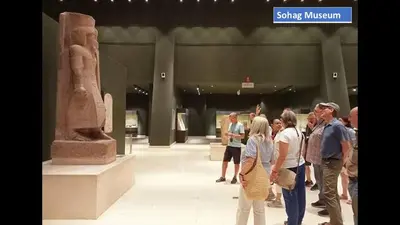 a group of people looking at a statue in a museum at Abo Elwafa Hotel in Suwhaj
