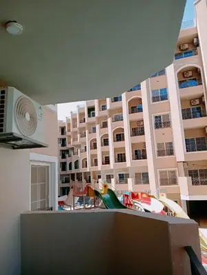 a view of a large apartment building from a balcony at جوليانا بيتش ريزورت in Hurghada