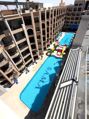 an aerial view of the pool on the balcony of a hotel at جوليانا بيتش ريزورت in Hurghada