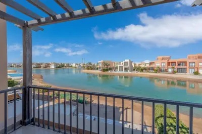 a view of a river from a balcony of a condo at Ultimate Beachstyle Getaway Gouna 2BR Twinhouse. BBQ, Lagoon & Pool Access in Hurghada