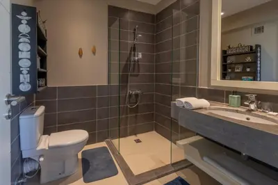 a bathroom with a toilet and a sink at Ultimate Beachstyle Getaway Gouna 2BR Twinhouse. BBQ, Lagoon & Pool Access in Hurghada