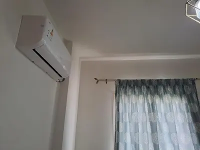 a room with a shower curtain and a window at 2 bedrooms cozy flat at makadi heights in Hurghada