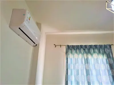 a room with a shower curtain and a window at 2 bedrooms cozy flat at makadi heights in Hurghada