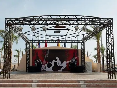 a metal structure with a stage with a painting on it at Private 3 bdrm apartment at ElKarma Aqua Beach Reaort in Hurghada