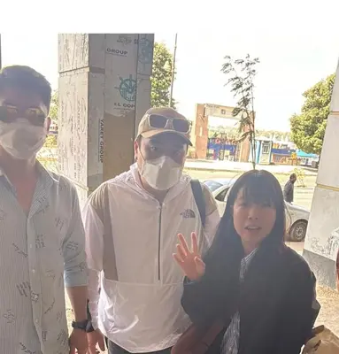 two men and a woman wearing face masks at Relaxation, fresh air, and a direct view of the Nile in Naj‘ al ‘Amrāb