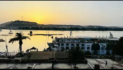 a view of a river with a boat in the water at Relaxation, fresh air, and a direct view of the Nile in Naj‘ al ‘Amrāb