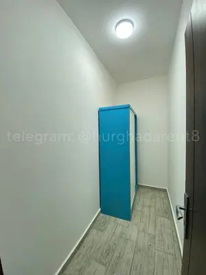 a room with a blue door in a room at Makramia Compound in Hurghada
