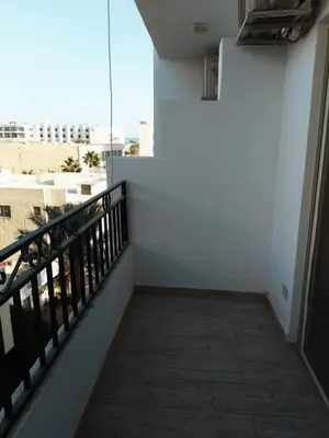 a balcony with a view of a building at Makramia Compound in Hurghada