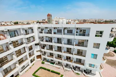 an aerial view of a white apartment building at Makramia Compound in Hurghada