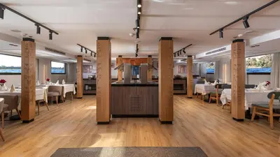 a dining room with white tables and chairs at TIA Boutique Nile Cruise - Accommodation Only - Every Monday from Luxor for 04 & 07 Nights - Every Friday From Aswan for 03 & 07 Nights in Luxor