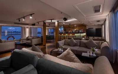 a large living room with couches and a television at TIA Boutique Nile Cruise - Accommodation Only - Every Monday from Luxor for 04 & 07 Nights - Every Friday From Aswan for 03 & 07 Nights in Luxor