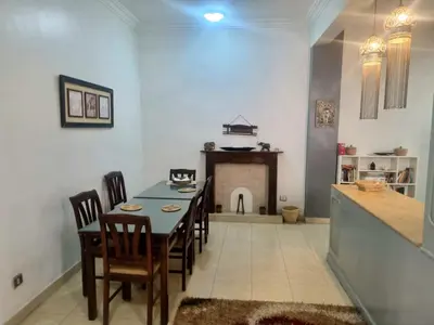 a kitchen and dining room with a table and chairs at Abo Hisham Nile Flat in Luxor