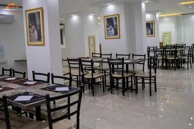 a group of tables and chairs in a room at Fox Hotel El Ahyaa in Hurghada