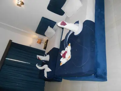 a room with a painting of shoes on a wall at Fox Hotel El Ahyaa in Hurghada