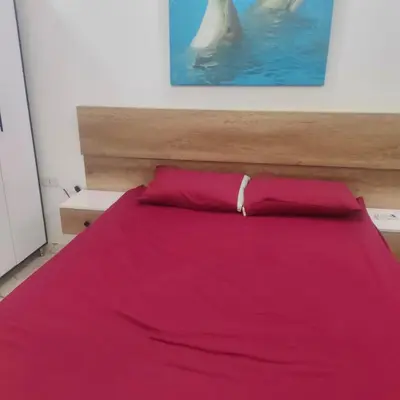 a bedroom with a bed with a polar bear in the water at Hurghada Palma Resort Studio in Hurghada