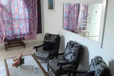 a living room with chairs and a table and a mirror at Villa 2 apartment 4 village veiw infront of Palma de Meritee in Hurghada